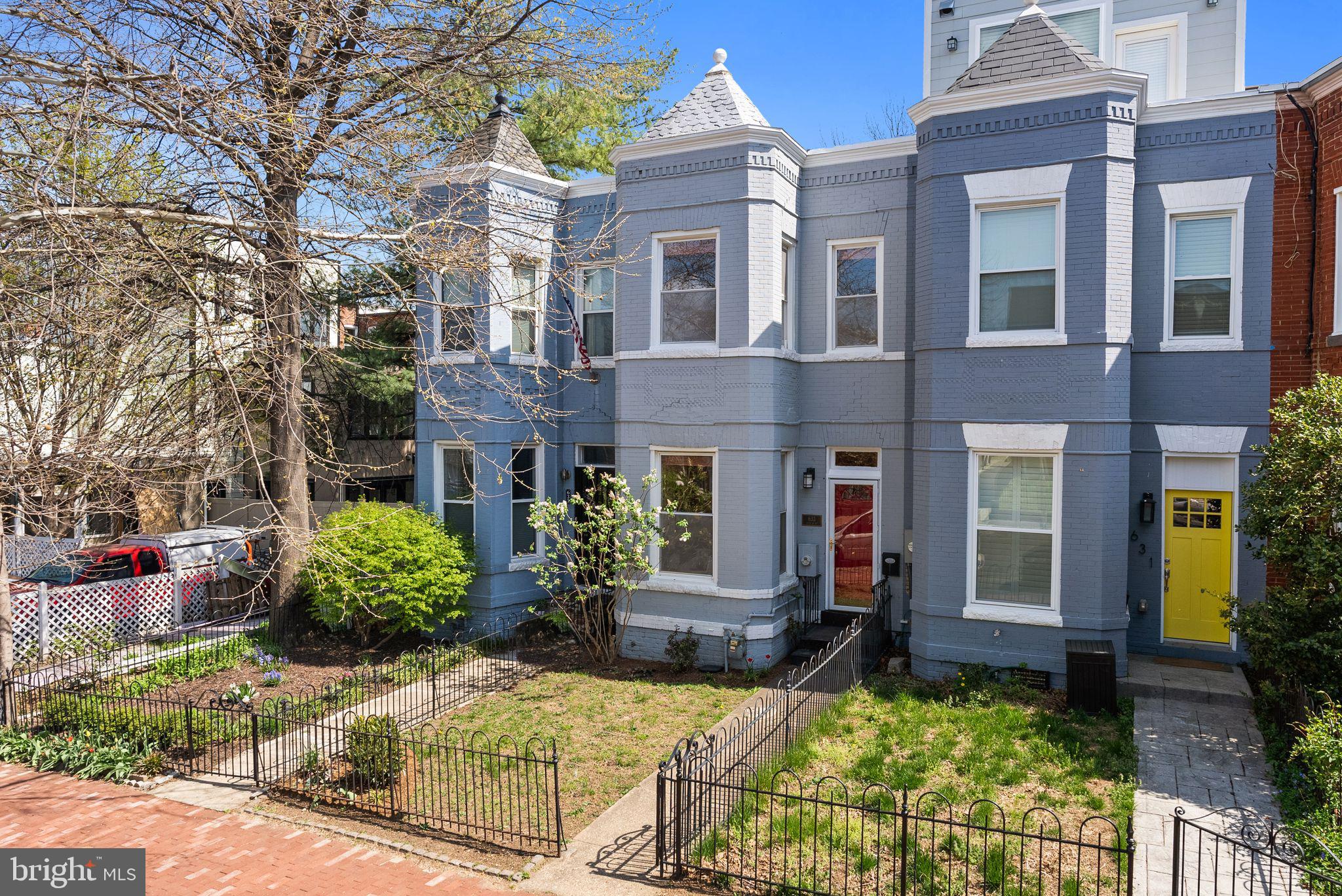 633 12th Street Northeast Washington, DC 20002 - Photo 2 of 44 front view of a brick house with a small yard