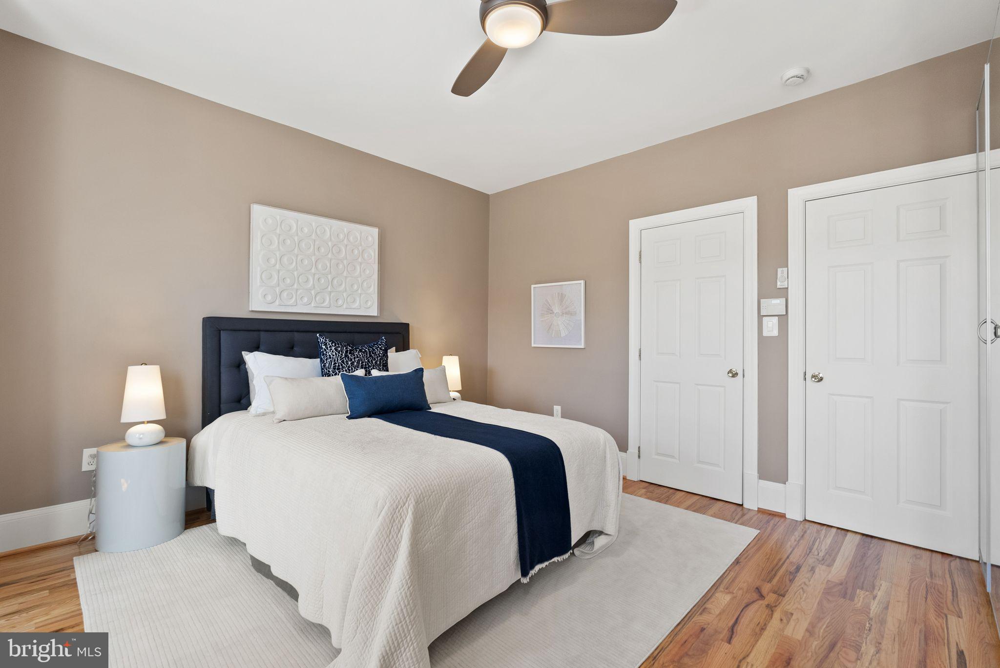 633 12th Street Northeast Washington, DC 20002 - Photo 22 of 44 a bedroom with a bed and wooden floor