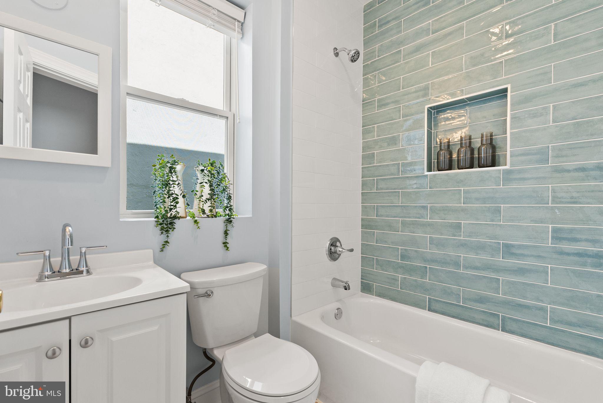 633 12th Street Northeast Washington, DC 20002 - Photo 27 of 44 a bathroom with a sink a toilet and shower