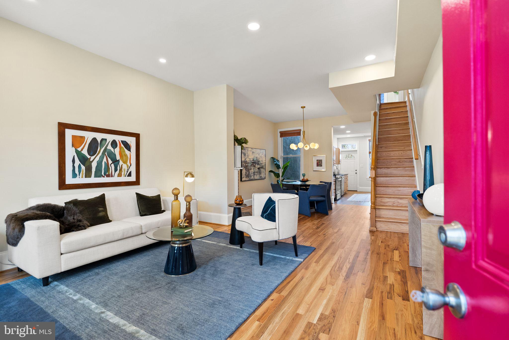 633 12th Street Northeast Washington, DC 20002 - Photo 3 of 44 a living room with furniture and a rug