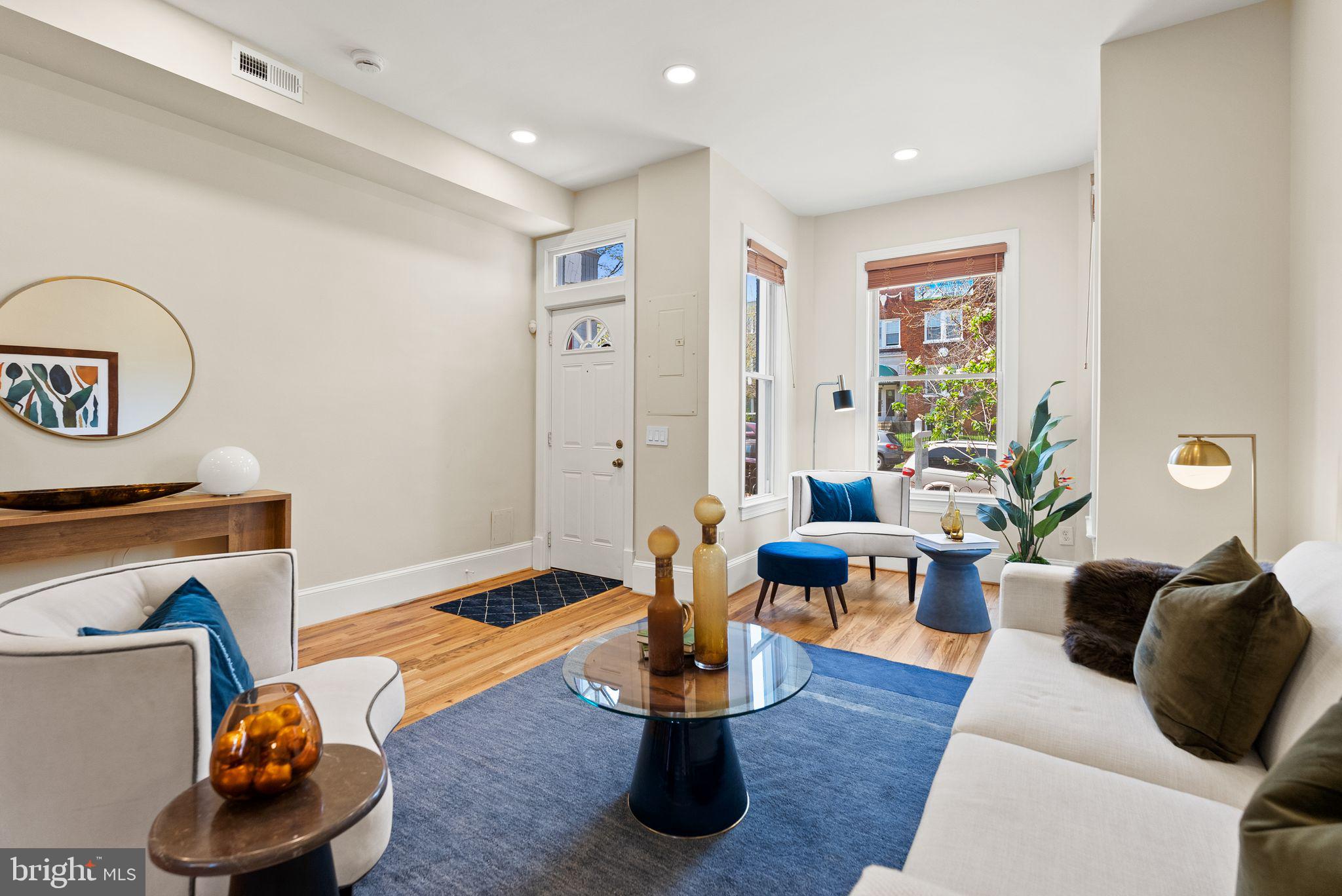 633 12th Street Northeast Washington, DC 20002 - Photo 7 of 44 a living room with furniture and a wooden floor