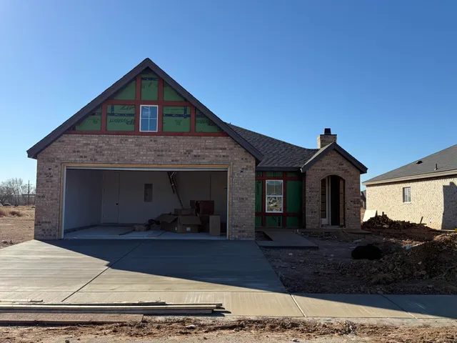 a front view of a house with yard