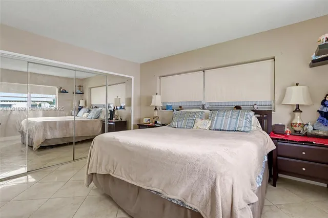 a bedroom with bed and a window