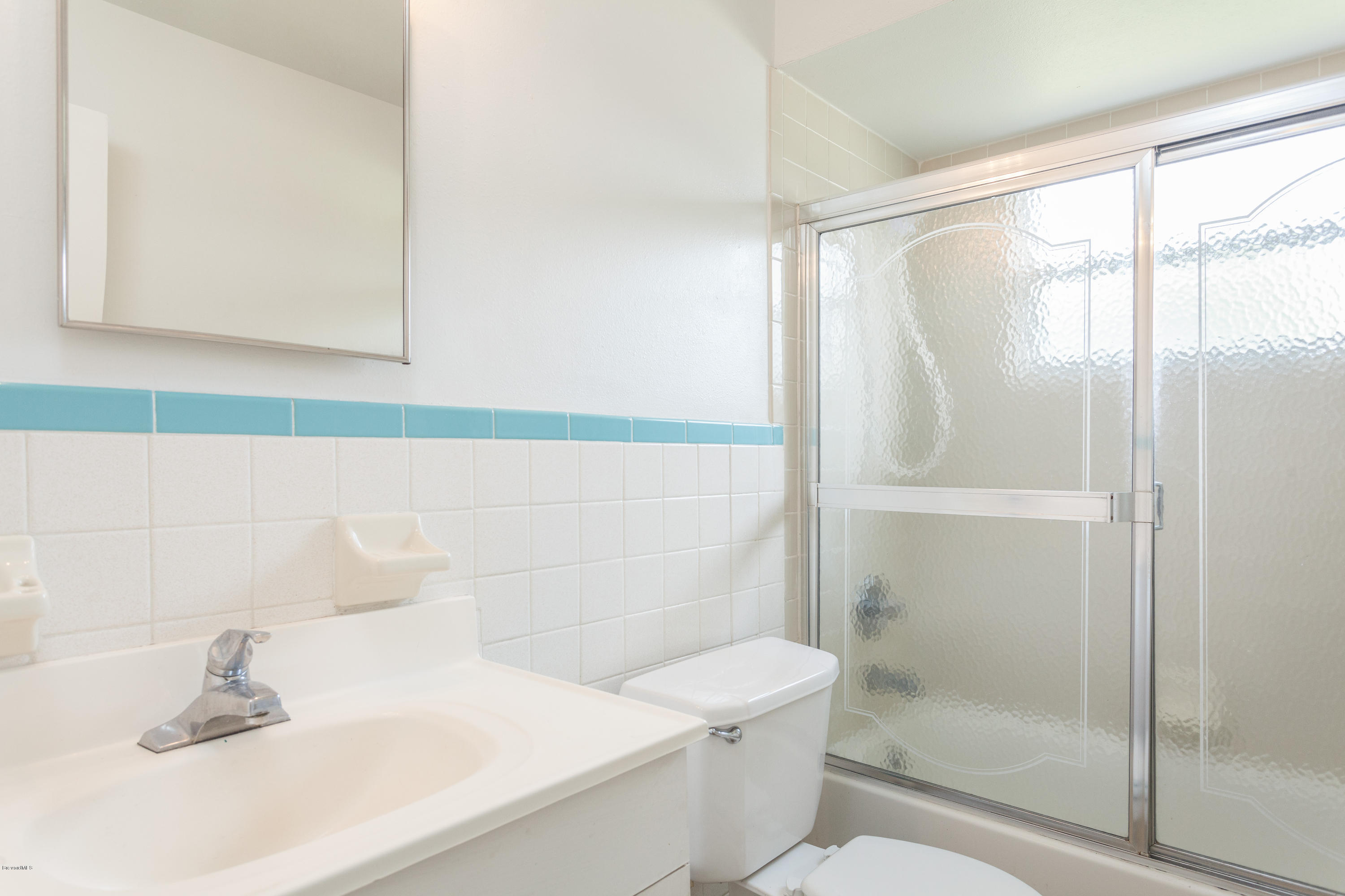 820 Sandgate Street Merritt Island, FL 32953 - Photo 11 of 13 a bathroom with a sink and a mirror