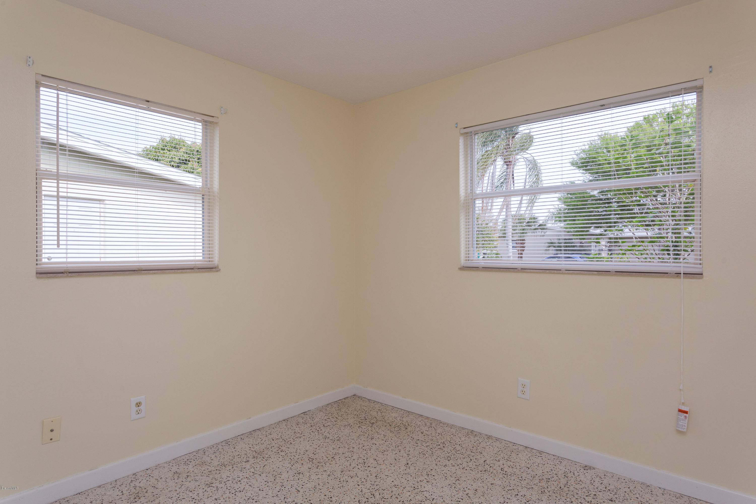 820 Sandgate Street Merritt Island, FL 32953 - Photo 10 of 13 an empty room with a window