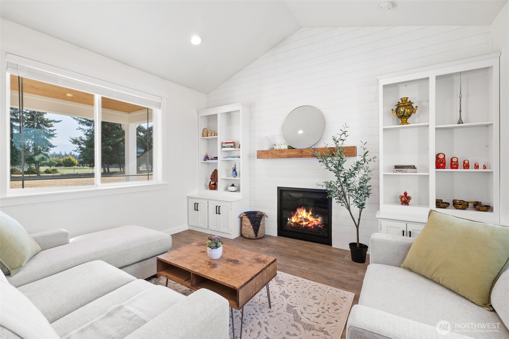 195 Laura Lane Sequim, WA 98382 - Photo 13 of 32 a living room with furniture and a fireplace