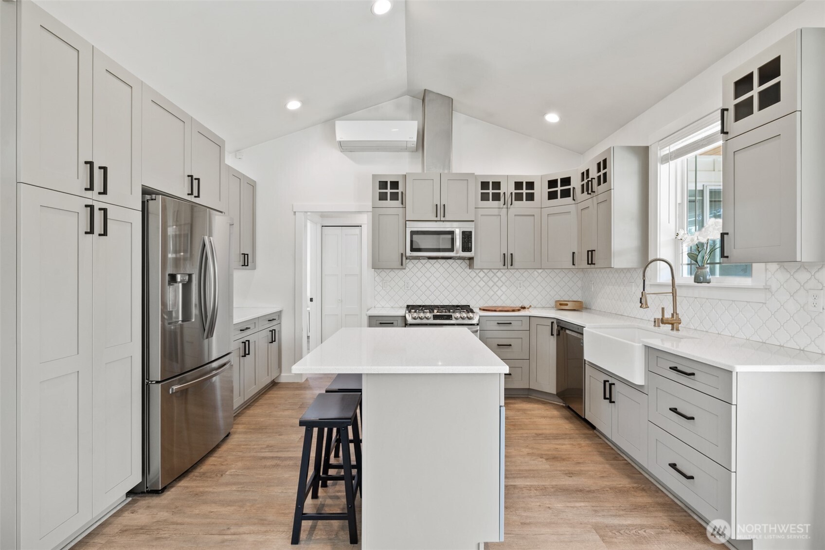 195 Laura Lane Sequim, WA 98382 - Photo 17 of 32 a large kitchen with stainless steel appliances lots of counter space and a sink