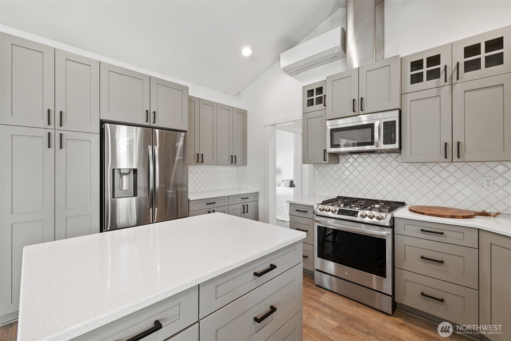 195 Laura Lane Sequim, WA 98382 - Photo 19 of 32 a kitchen with stainless steel appliances a stove microwave and refrigerator