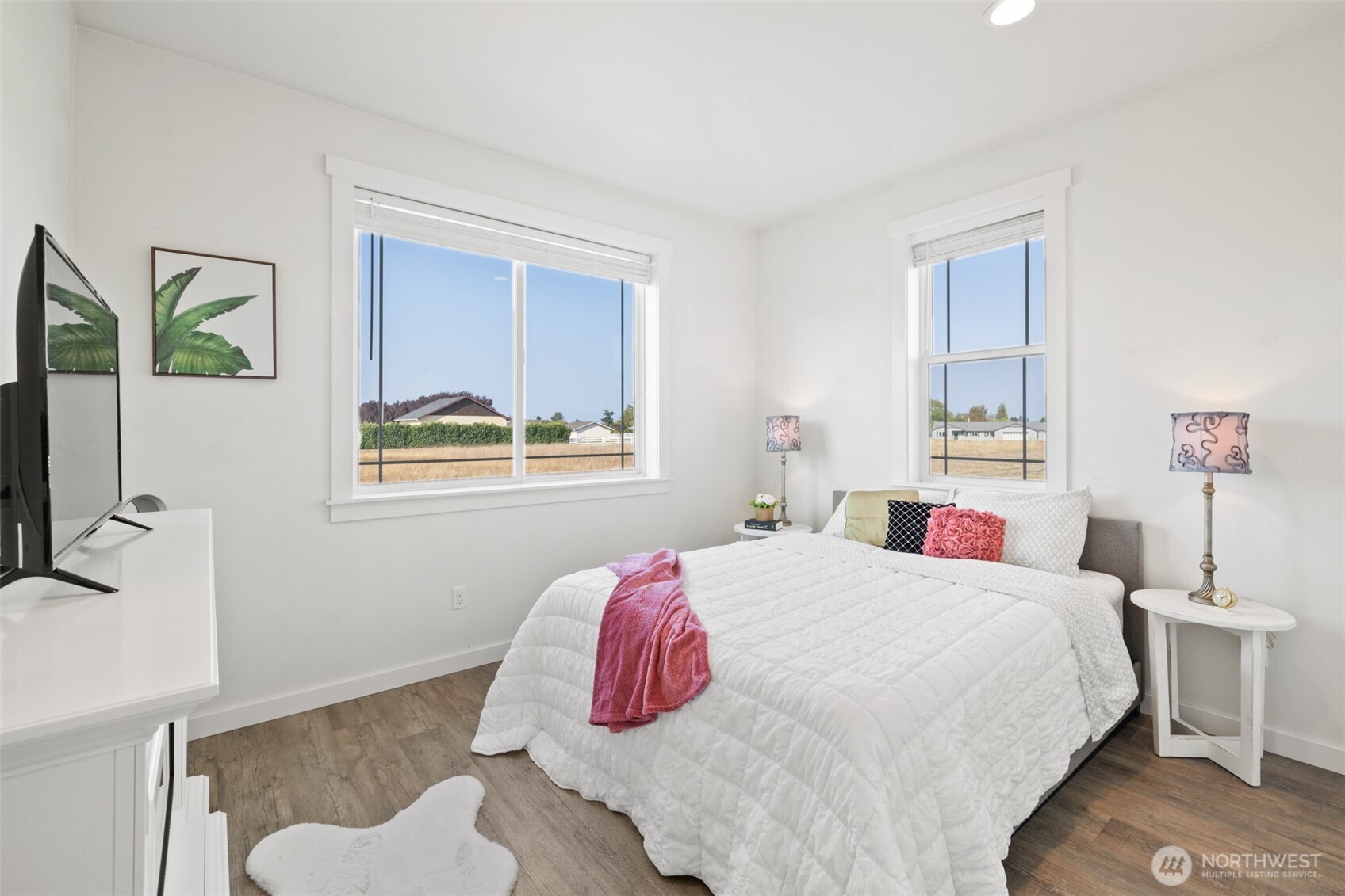 195 Laura Lane Sequim, WA 98382 - Photo 22 of 32 a bedroom with a bed and a window