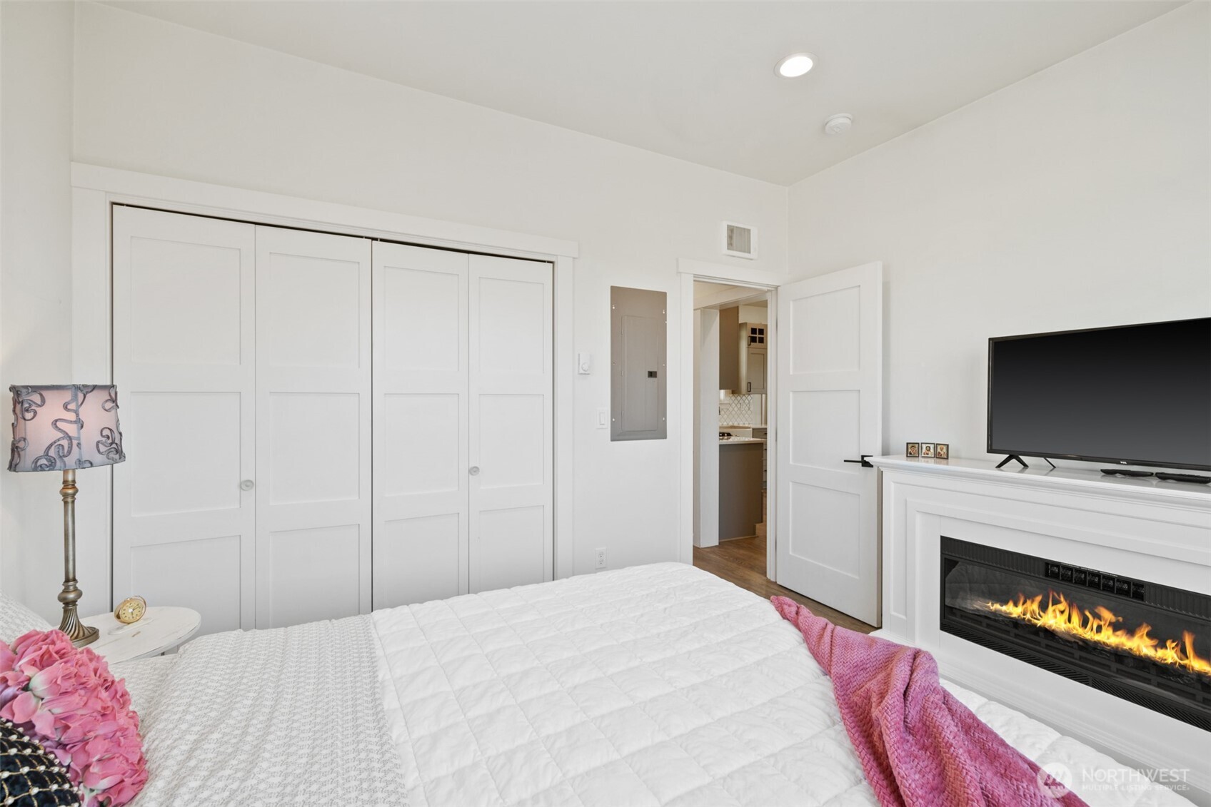 195 Laura Lane Sequim, WA 98382 - Photo 23 of 32 a bedroom with a bed and a flat screen tv