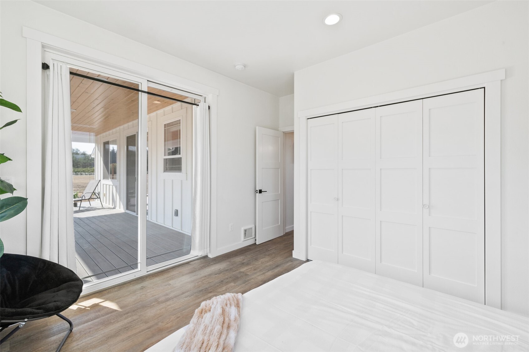 195 Laura Lane Sequim, WA 98382 - Photo 25 of 32 a bedroom with a bed and a window