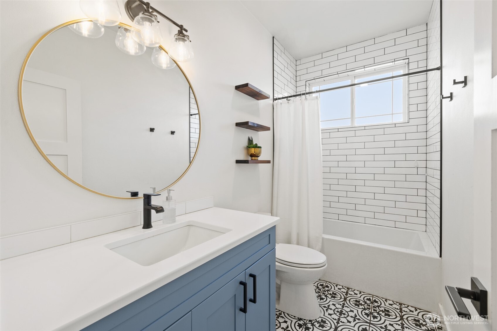 195 Laura Lane Sequim, WA 98382 - Photo 26 of 32 a bathroom with a sink a toilet and shower