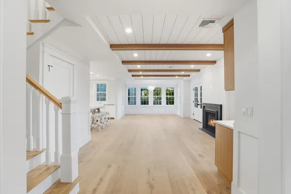a view of an entryway with wooden floor