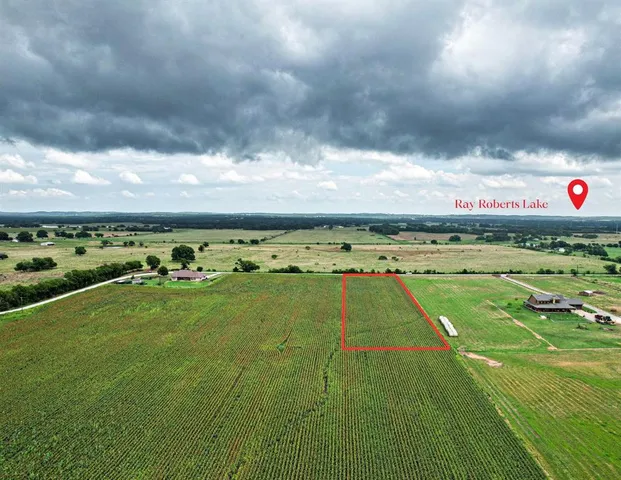 a view of an outdoor space and basketball court