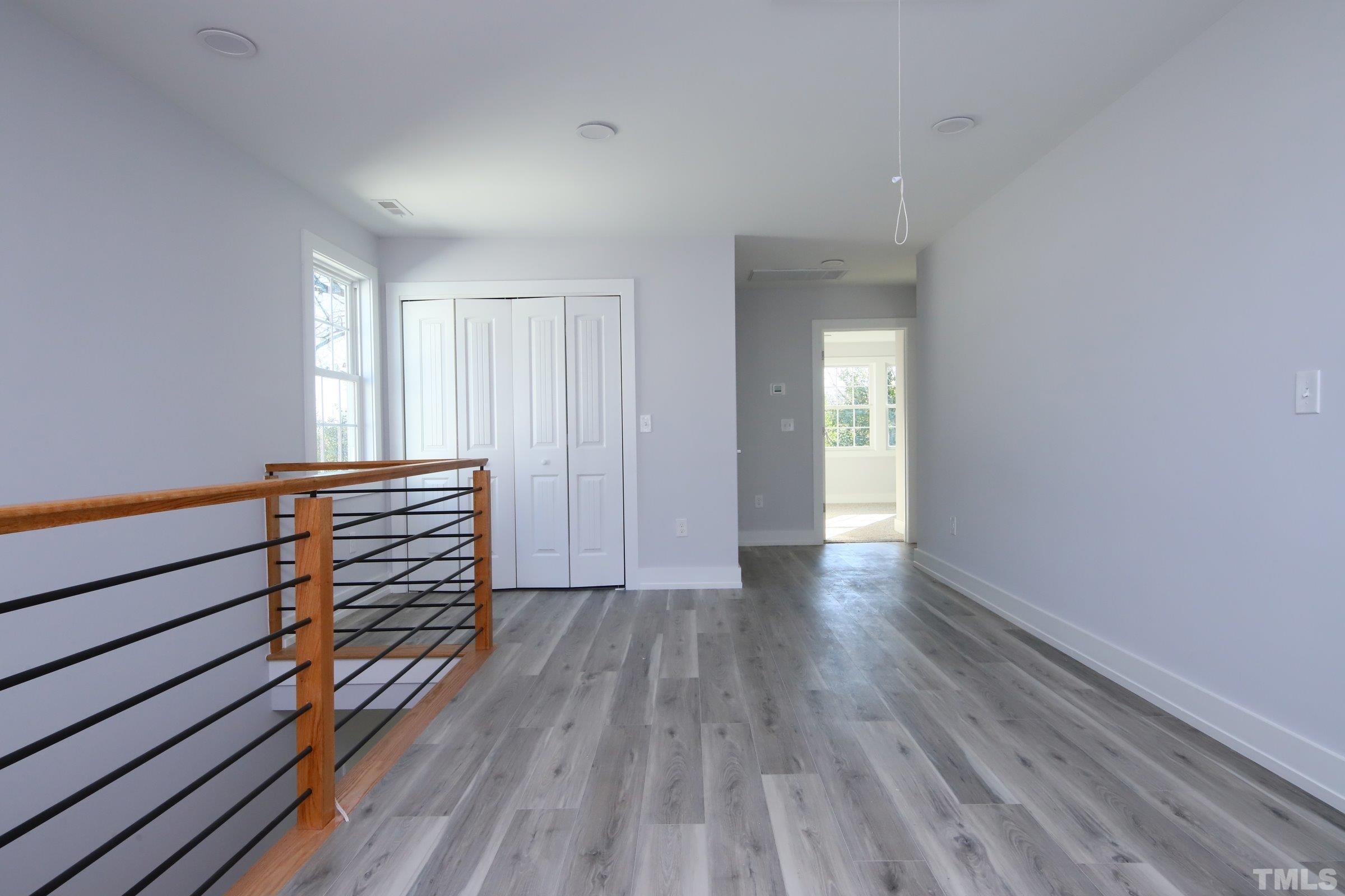 1412 East Jones Street Raleigh, NC 27610 - Photo 18 of 41 a view of wooden floor and windows in a room