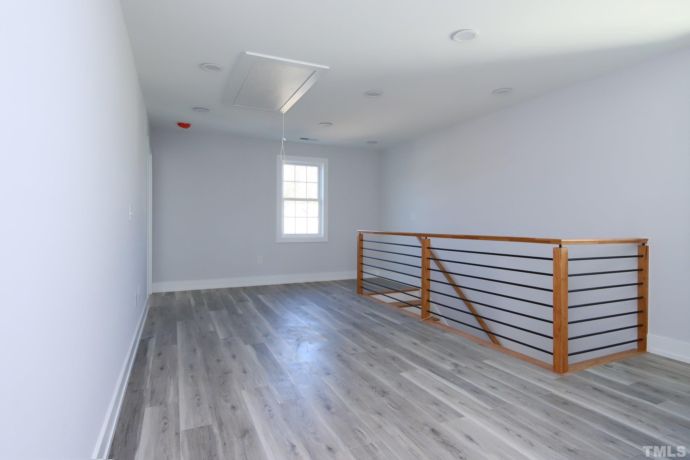 1412 East Jones Street Raleigh, NC 27610 - Photo 19 of 41 a view of a room with wooden floor and window
