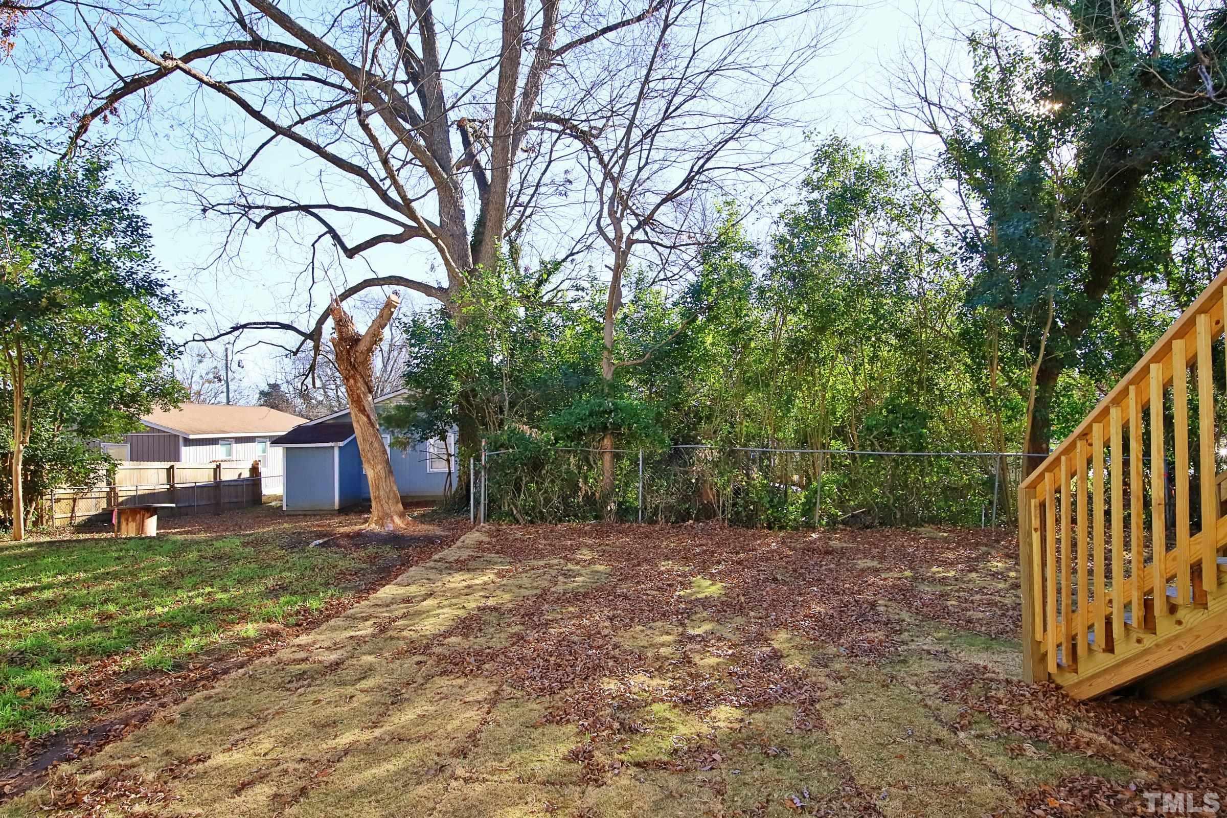 1412 East Jones Street Raleigh, NC 27610 - Photo 37 of 41 a view of a house with a yard