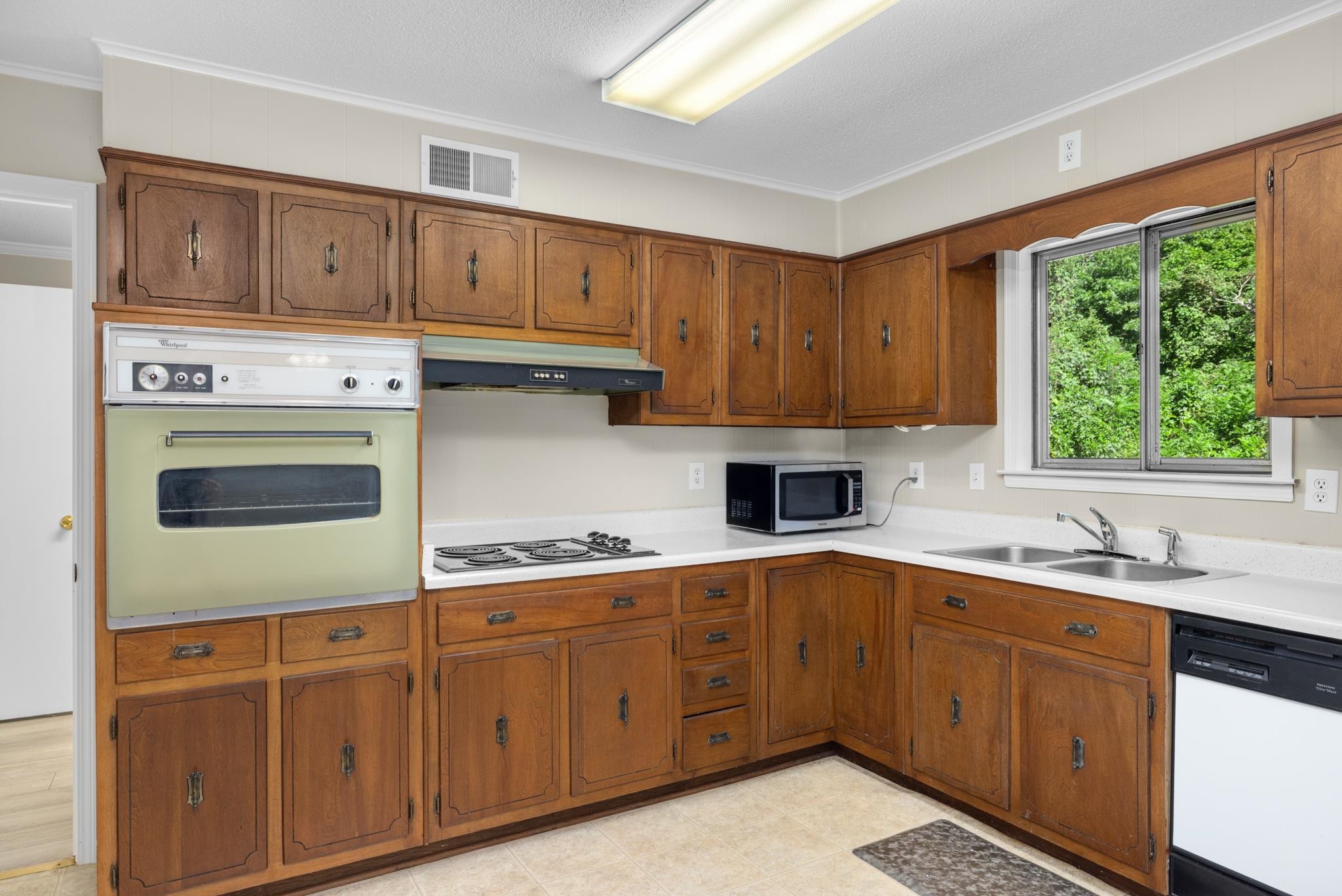 766 Fite Road Memphis, TN 38127 - Photo 11 of 30 a kitchen with a sink window and cabinets