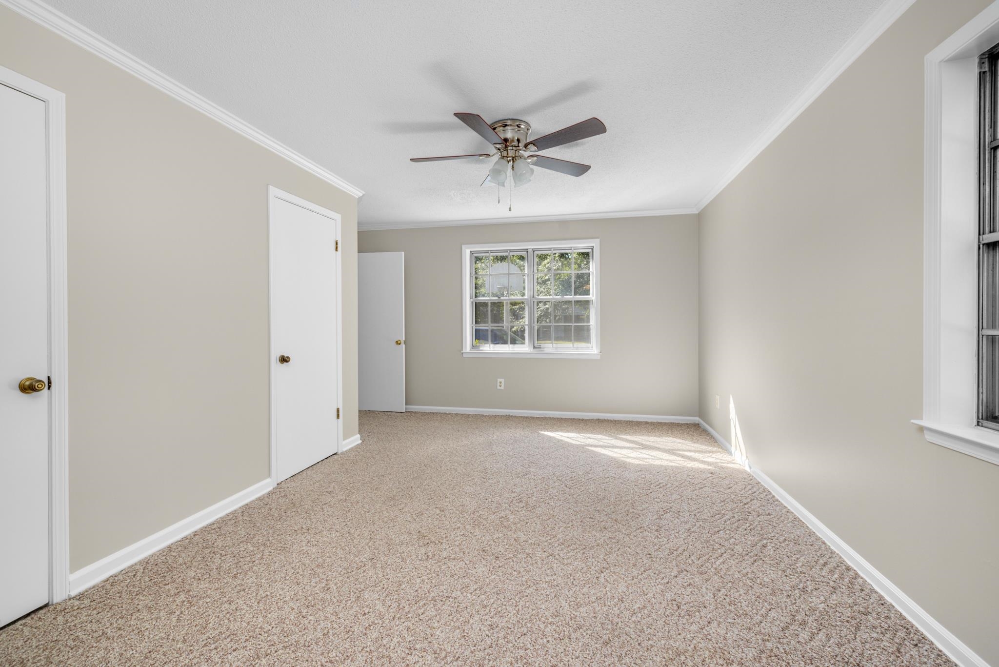 766 Fite Road Memphis, TN 38127 - Photo 16 of 30 an empty room with windows and fan