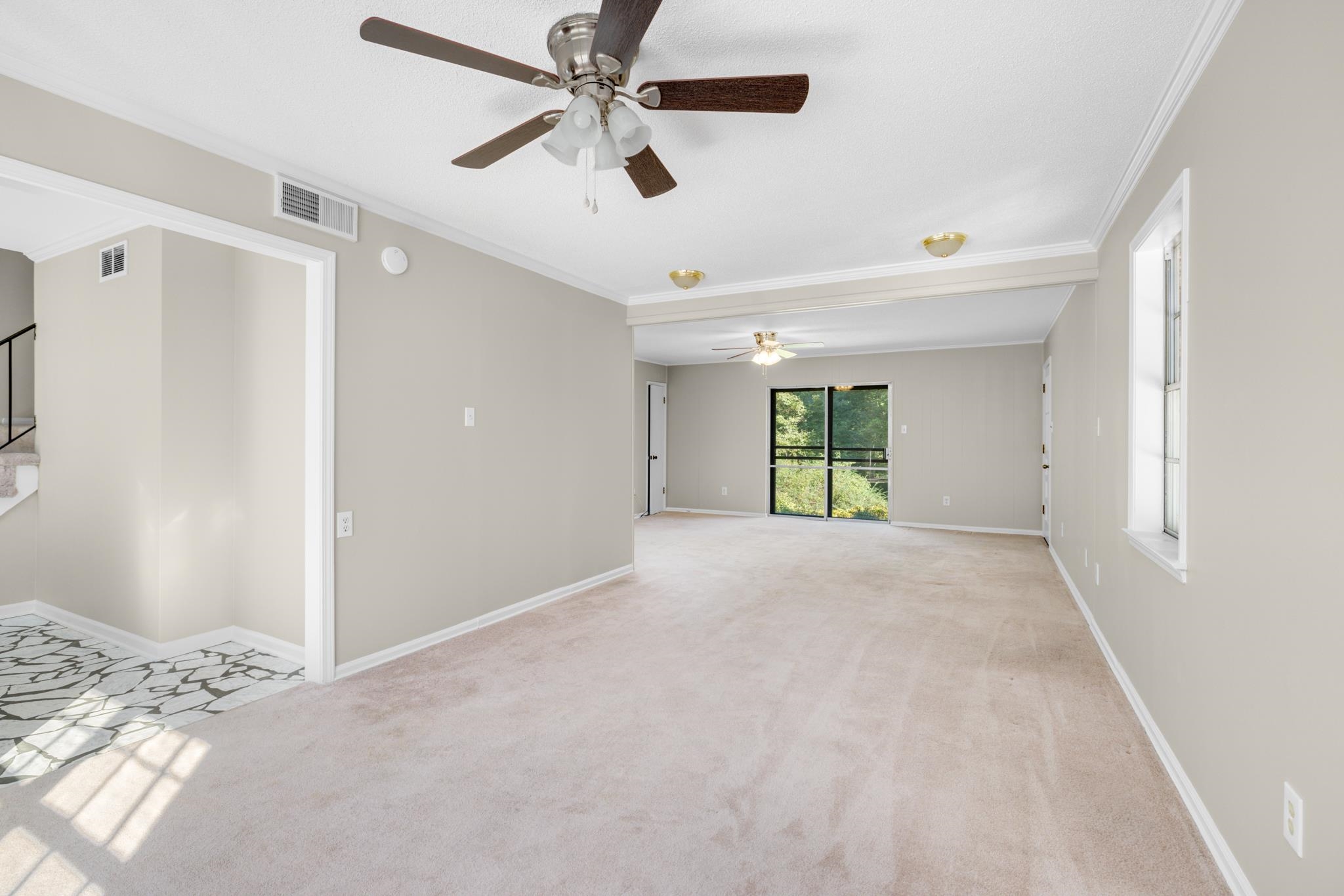 766 Fite Road Memphis, TN 38127 - Photo 5 of 30 a view of a big room with wooden floor and a chandelier fan