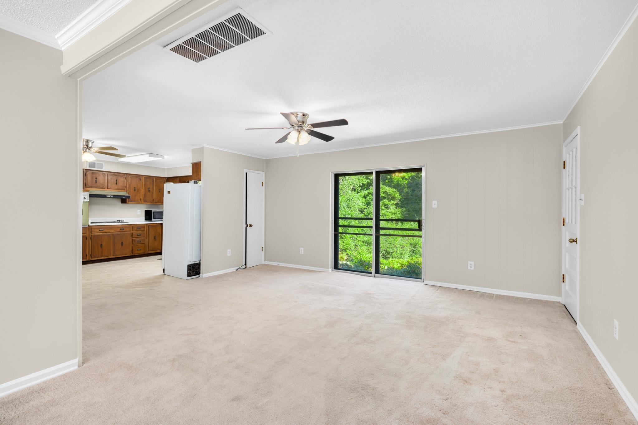 766 Fite Road Memphis, TN 38127 - Photo 6 of 30 a view of an empty room with a window and kitchen