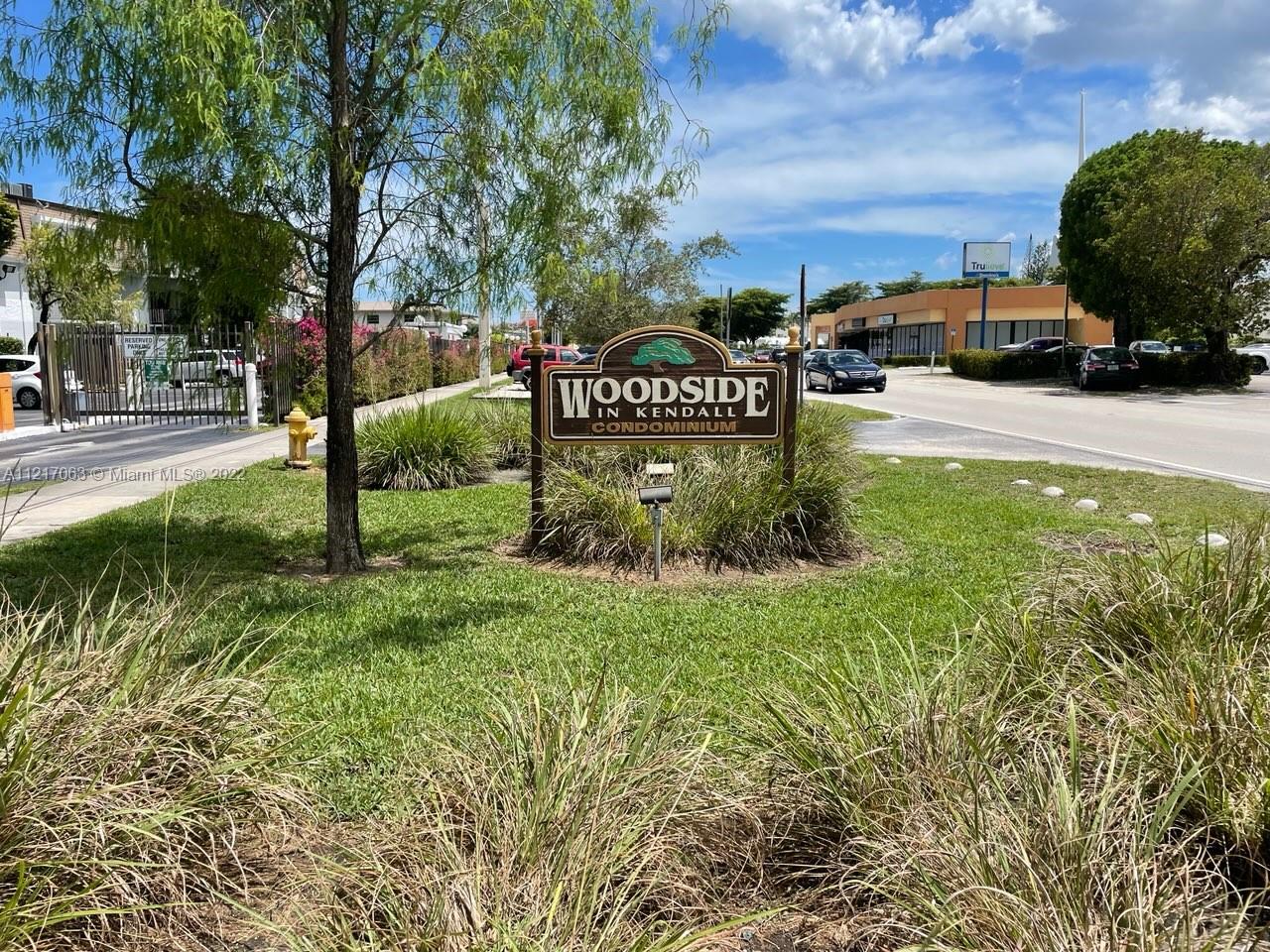 9611 Southwest 77th Avenue, Unit 108A Miami, FL 33156 - Photo 1 of 12 a view of a street with houses