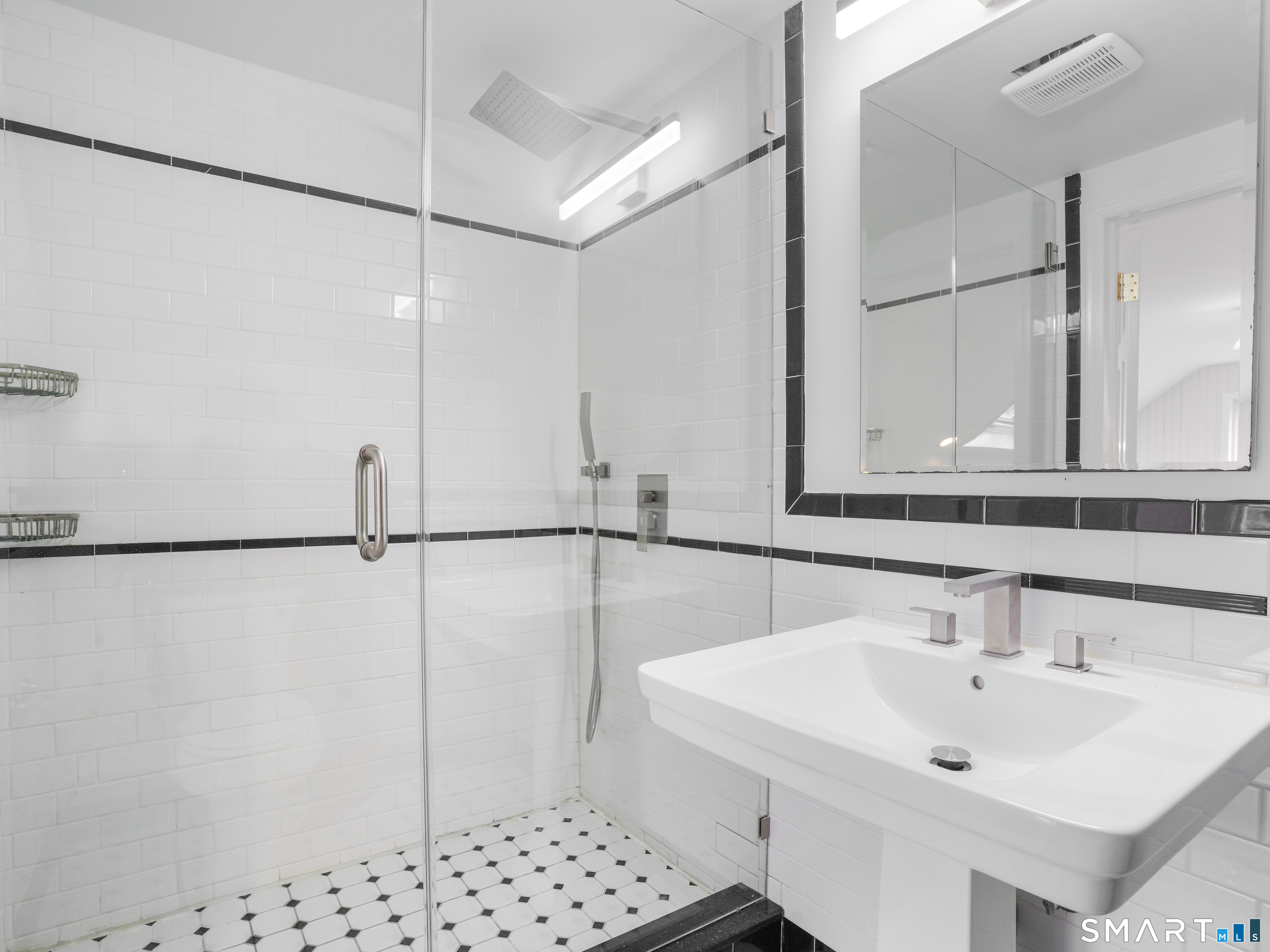3125 Old Town Road Bridgeport, CT 06606 - Photo 18 of 24 a bathroom with a sink and a mirror