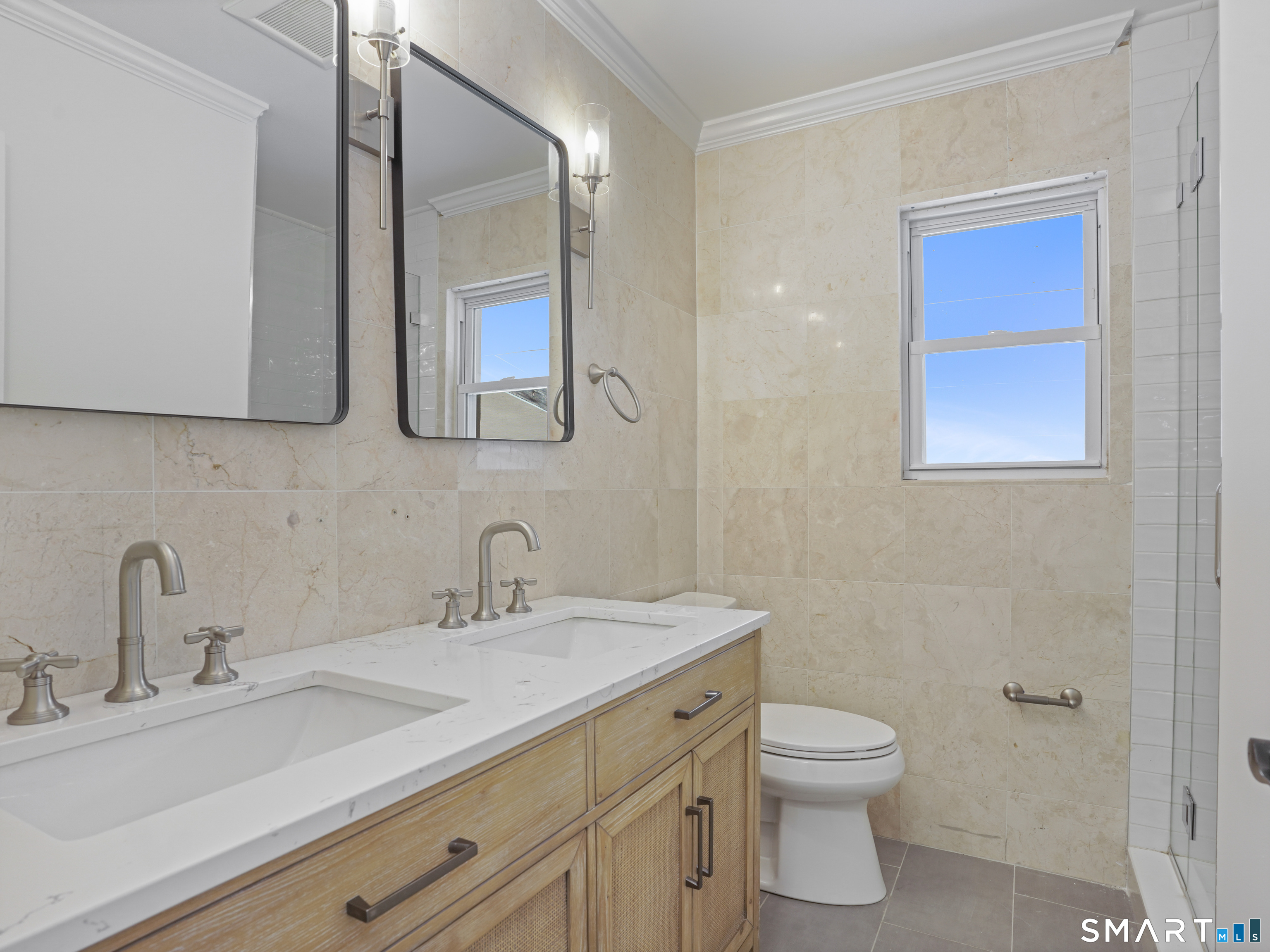 3125 Old Town Road Bridgeport, CT 06606 - Photo 24 of 24 a bathroom with a toilet sink and mirror