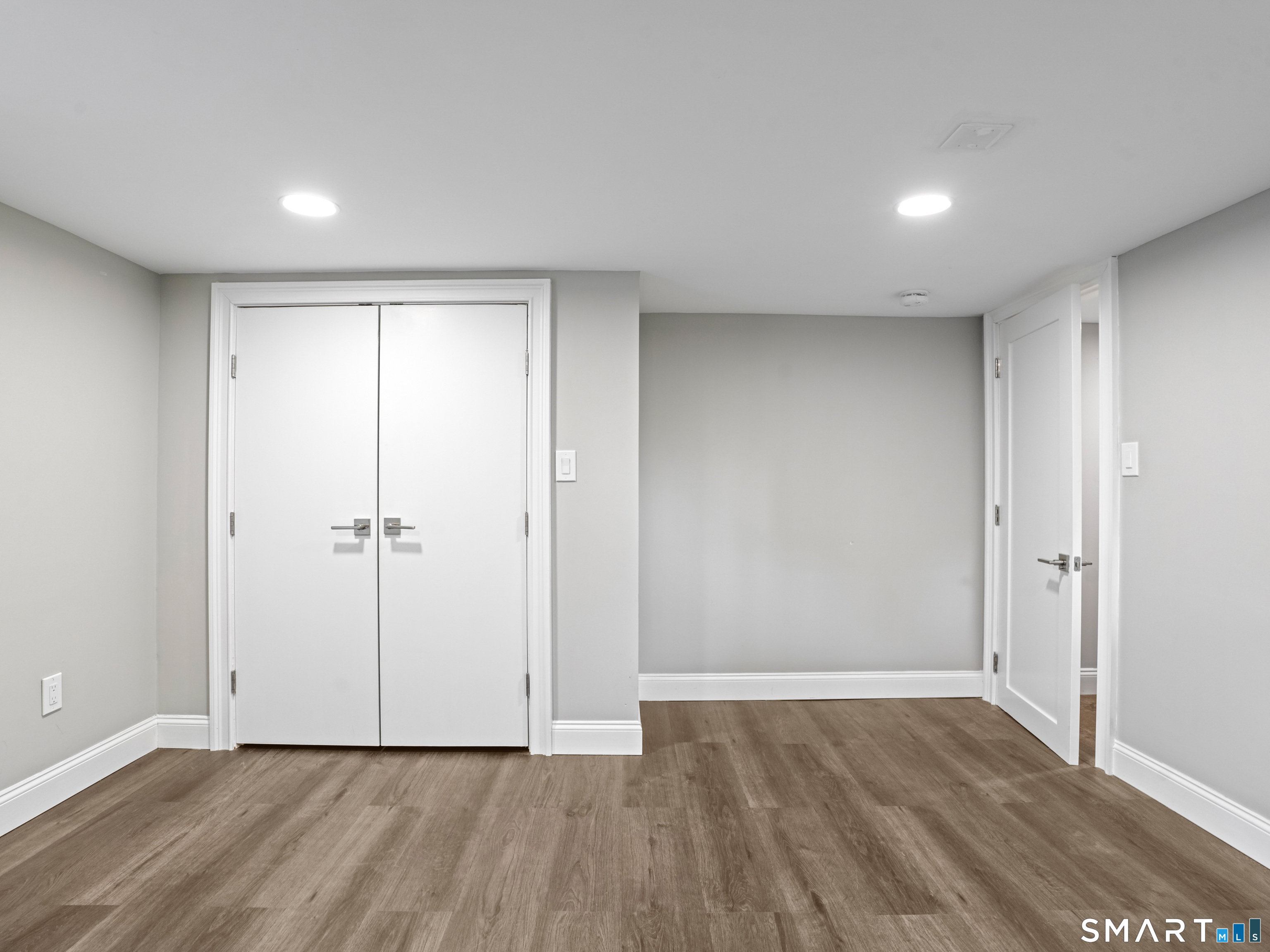 3125 Old Town Road Bridgeport, CT 06606 - Photo 5 of 24 a view of an empty room with wooden floor