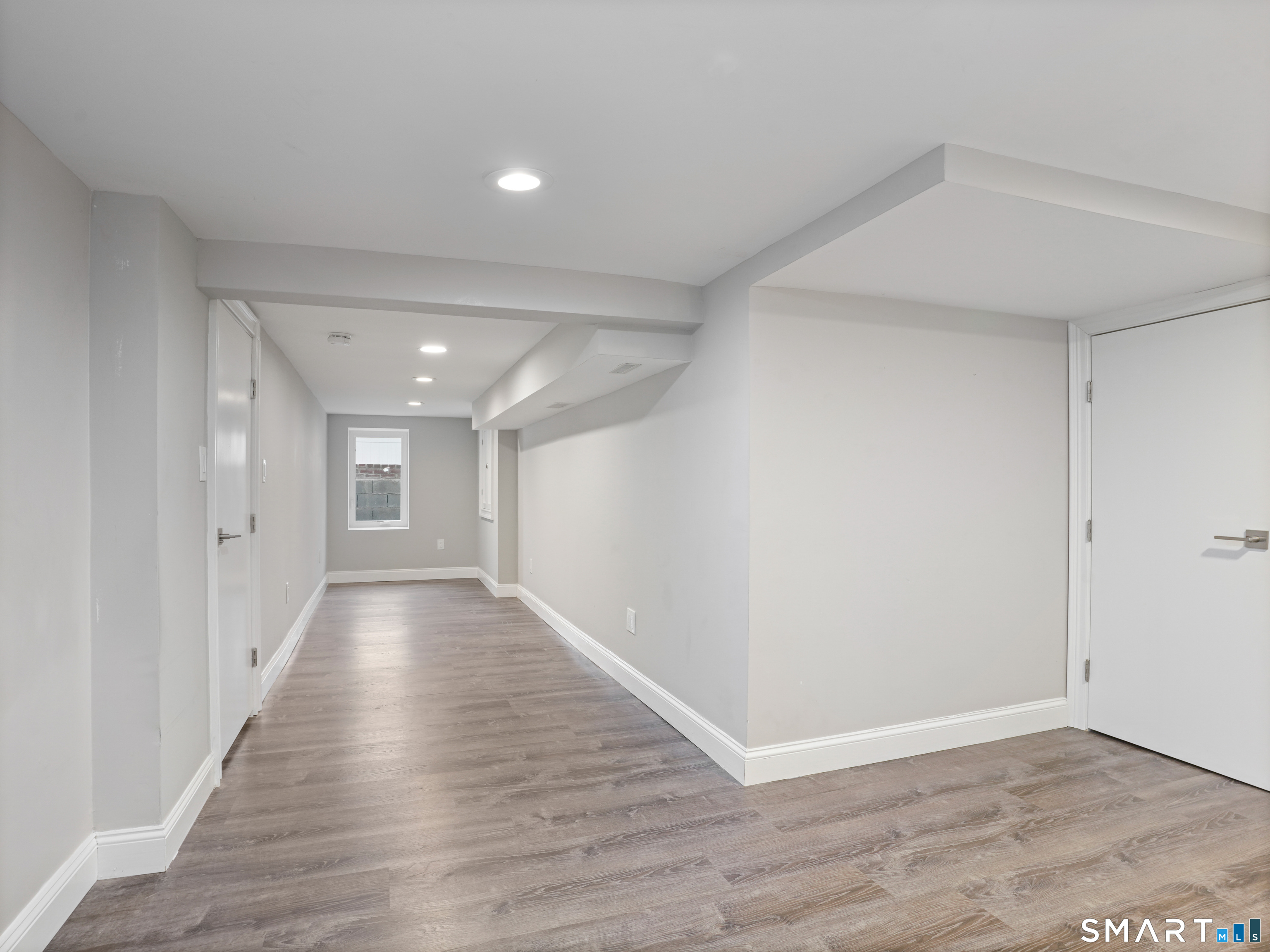 3125 Old Town Road Bridgeport, CT 06606 - Photo 7 of 24 a view of a hallway with wooden floor