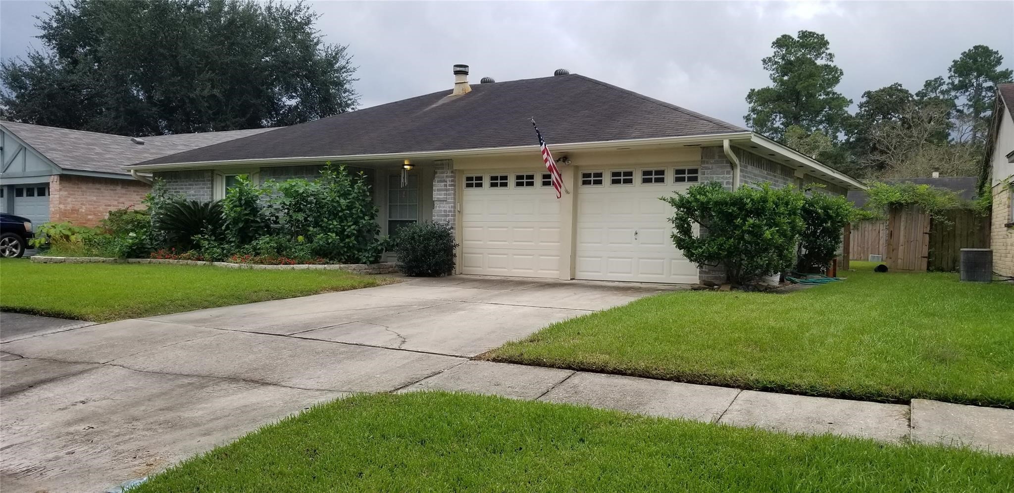 6702 Lynngate Drive Spring, TX 77373 - Photo 1 of 6 a view of a house with a garden