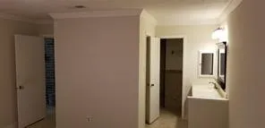 a view of a bathroom from a hallway