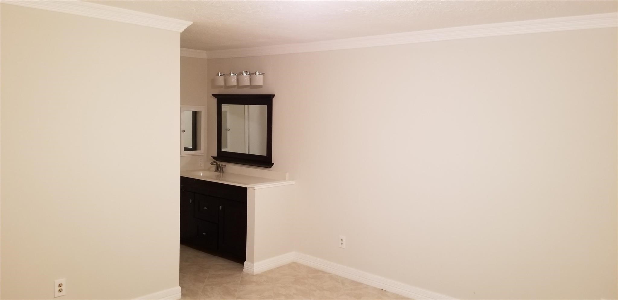 6702 Lynngate Drive Spring, TX 77373 - Photo 6 of 6 a picture of a wall with a hallway