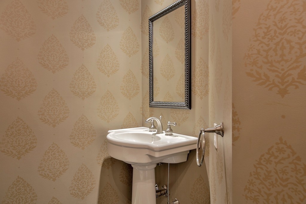 209 Main Street Boxford, MA 01921 - Photo 15 of 30 a bathroom with a sink and a mirror