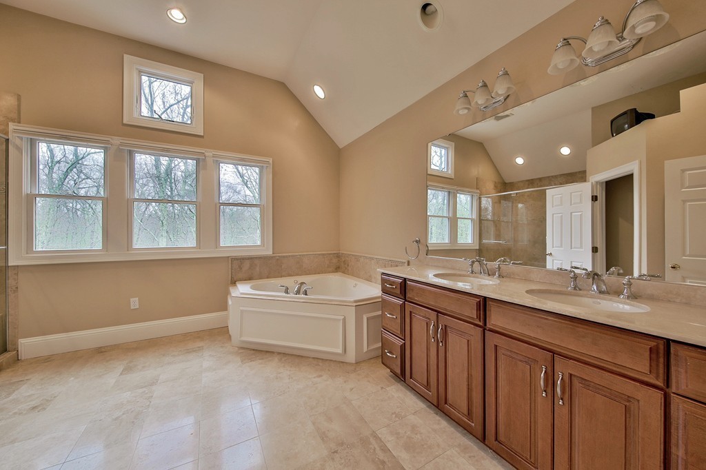 209 Main Street Boxford, MA 01921 - Photo 17 of 30 a bathroom with a tub sink and mirror