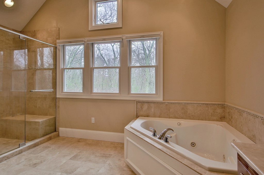 209 Main Street Boxford, MA 01921 - Photo 18 of 30 a bathroom with a tub and a window