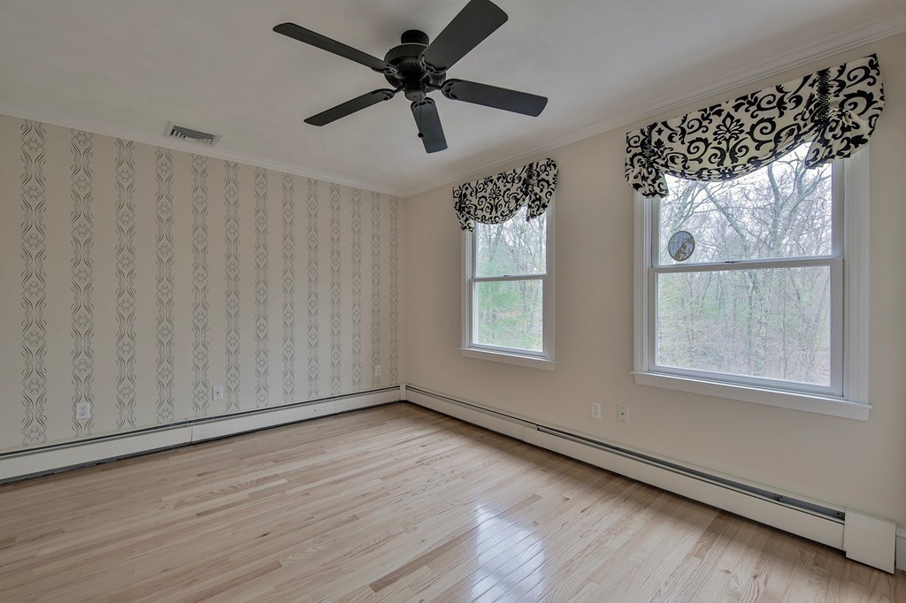209 Main Street Boxford, MA 01921 - Photo 20 of 30 wooden floor in an empty room with a window