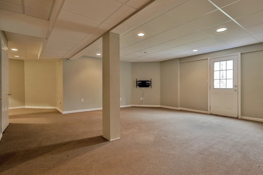 209 Main Street Boxford, MA 01921 - Photo 24 of 30 an empty room with windows and closet
