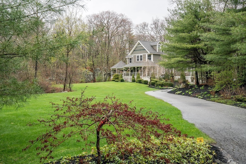 209 Main Street Boxford, MA 01921 - Photo 29 of 30 a front view of a house with a yard and trees