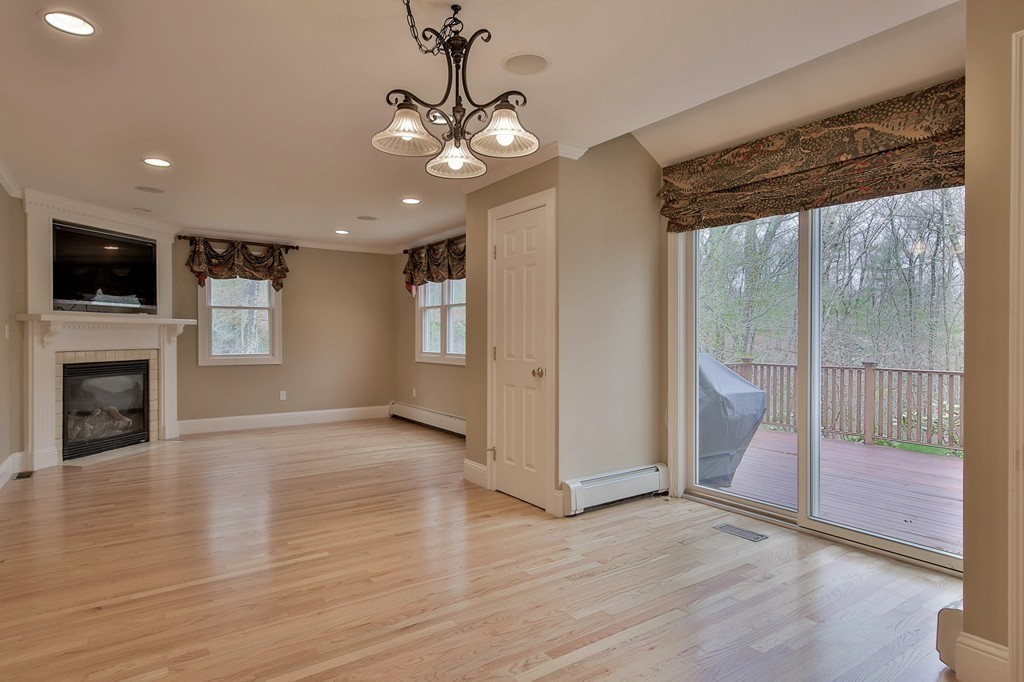 209 Main Street Boxford, MA 01921 - Photo 6 of 30 a view of a livingroom with a ceiling fan window and wooden floor