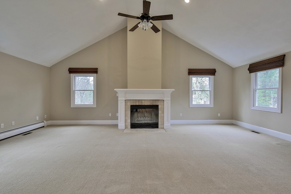 209 Main Street Boxford, MA 01921 - Photo 9 of 30 an empty room with windows and fireplace