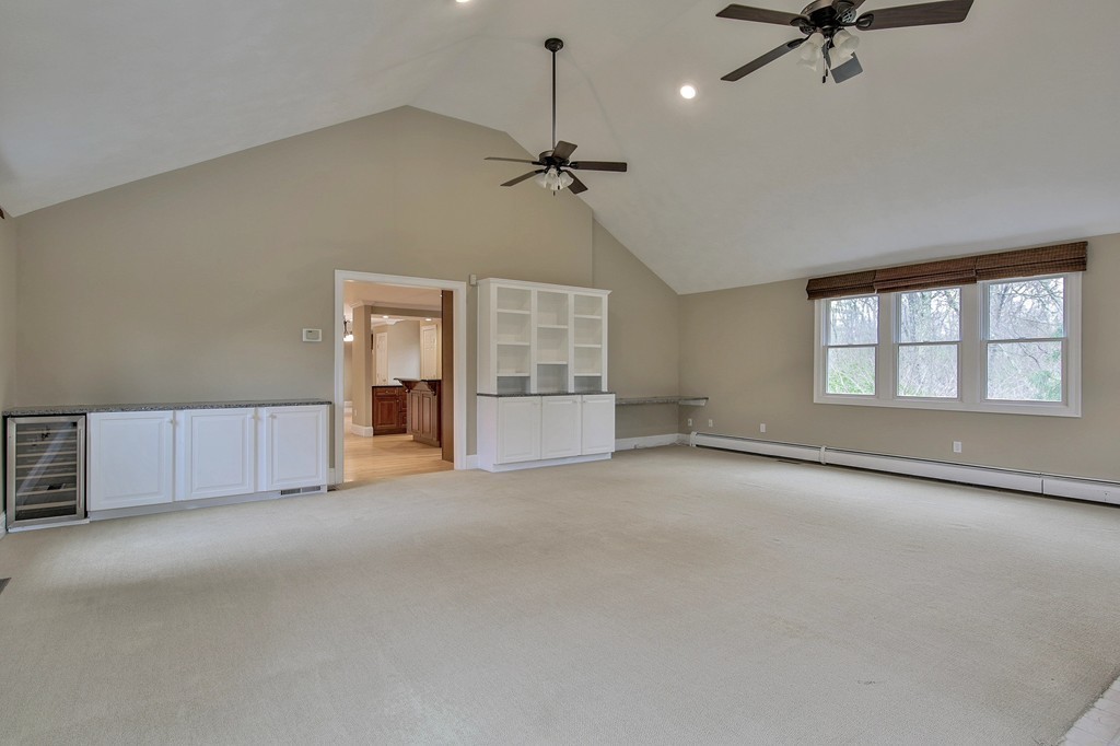 209 Main Street Boxford, MA 01921 - Photo 10 of 30 an empty room with windows and fan