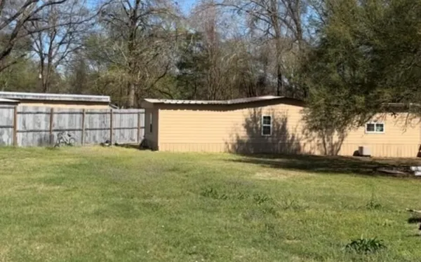 a backyard of a house with lots of green space