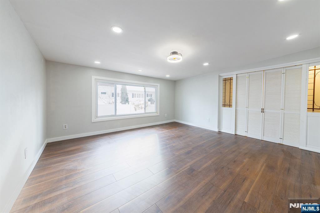 34 Kearny Street Lyndhurst, NJ 07071 - Photo 11 of 29 an empty room with wooden floor and windows