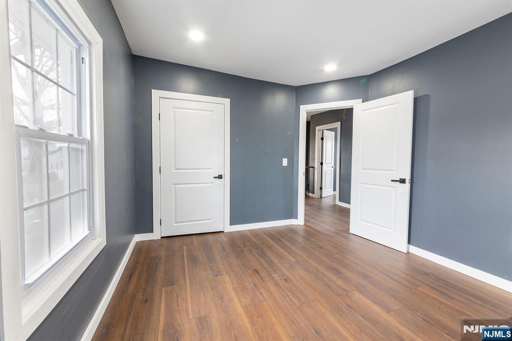 34 Kearny Street Lyndhurst, NJ 07071 - Photo 16 of 29 a view of hallway with a large window and wooden floor