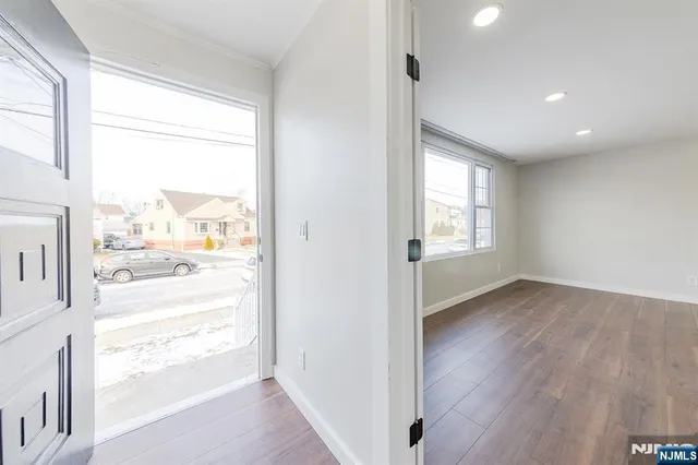 a view of an empty room and a window