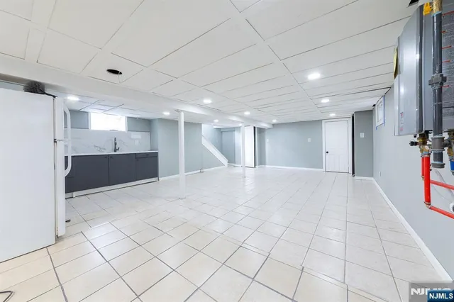 a kitchen with a refrigerator and a sink