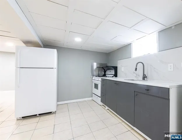 a white toilet sitting next to a bathroom sink