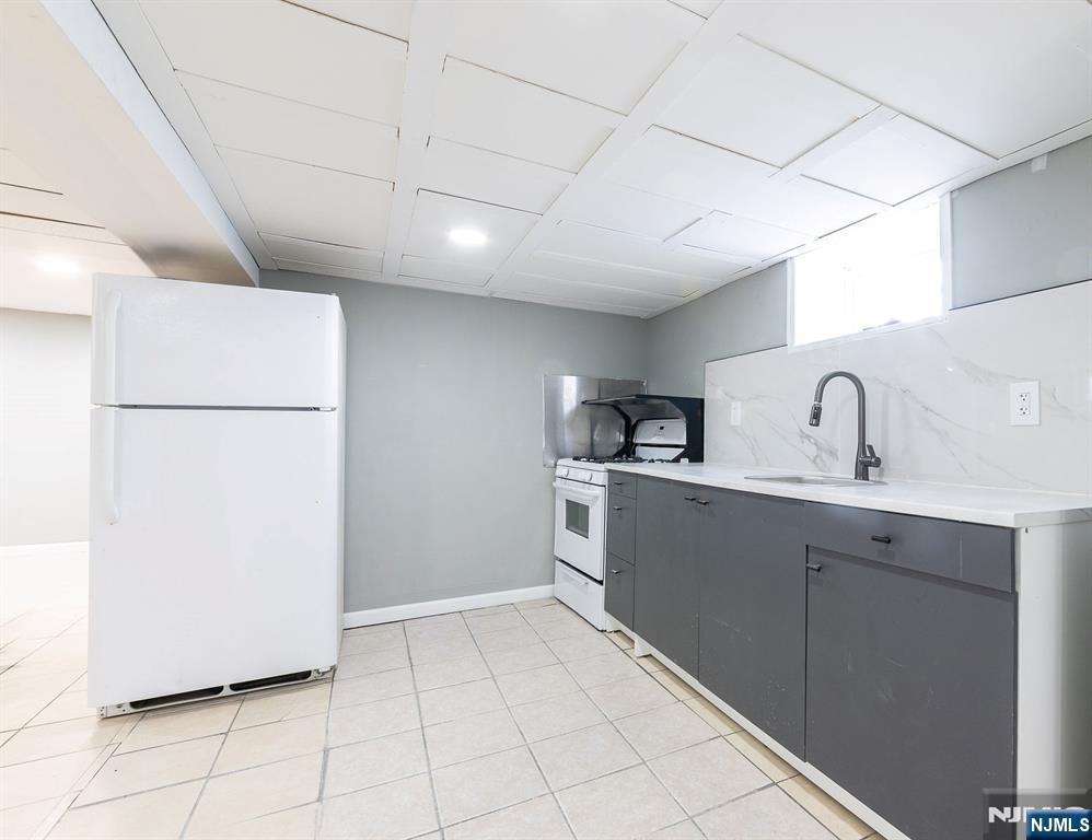 34 Kearny Street Lyndhurst, NJ 07071 - Photo 24 of 29 a kitchen with a refrigerator and a sink