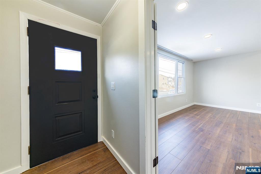 34 Kearny Street Lyndhurst, NJ 07071 - Photo 3 of 29 wooden floor in an empty room with a window